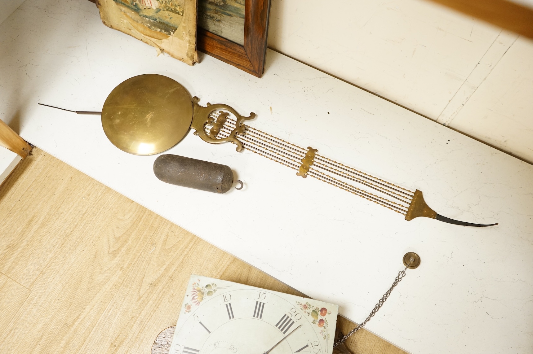 A 19th century wall clock with pendulum and weight, the floral dial inscribed Wm Ball, High Wycombe